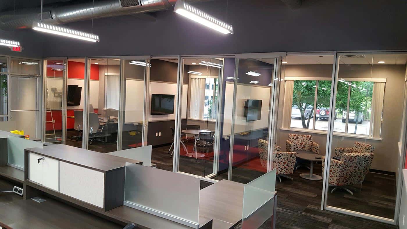 Meeting and conference rooms with sliding glass walls for audible privacy