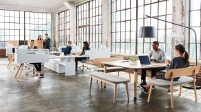 Coworkers enjoy their highly designed office workspace together.