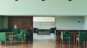 Trendy colors to use in office design. Use dark green to bring drama and mood to the room.