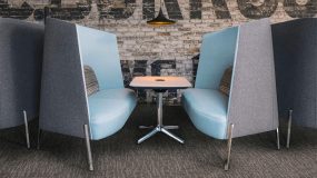 Modern design booth with small table, high wall blue and gray booths