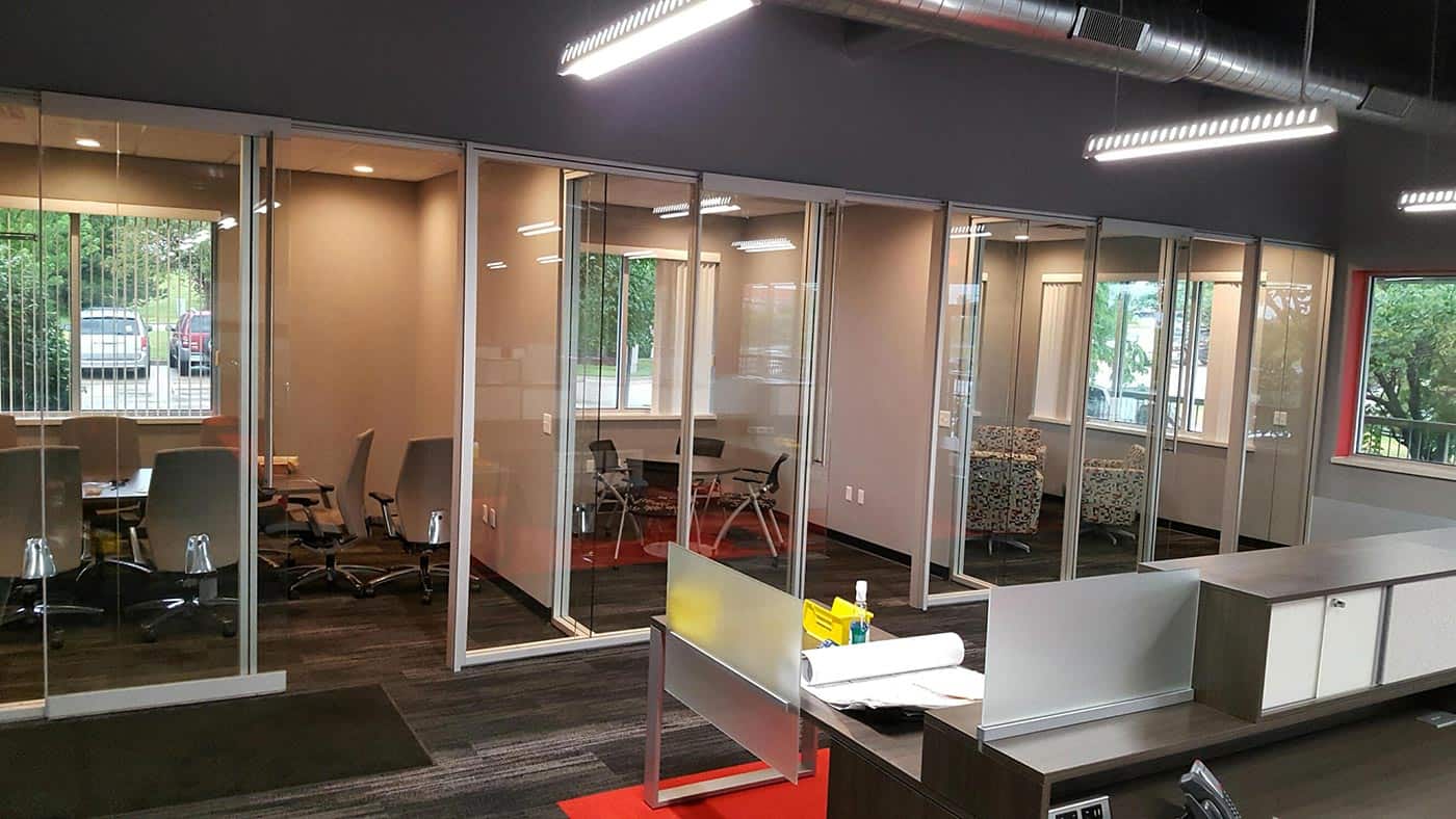 Meeting and conference rooms with sliding glass walls used for privacy.